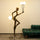 antique gold juggler sculptural floor lamp with orb lights