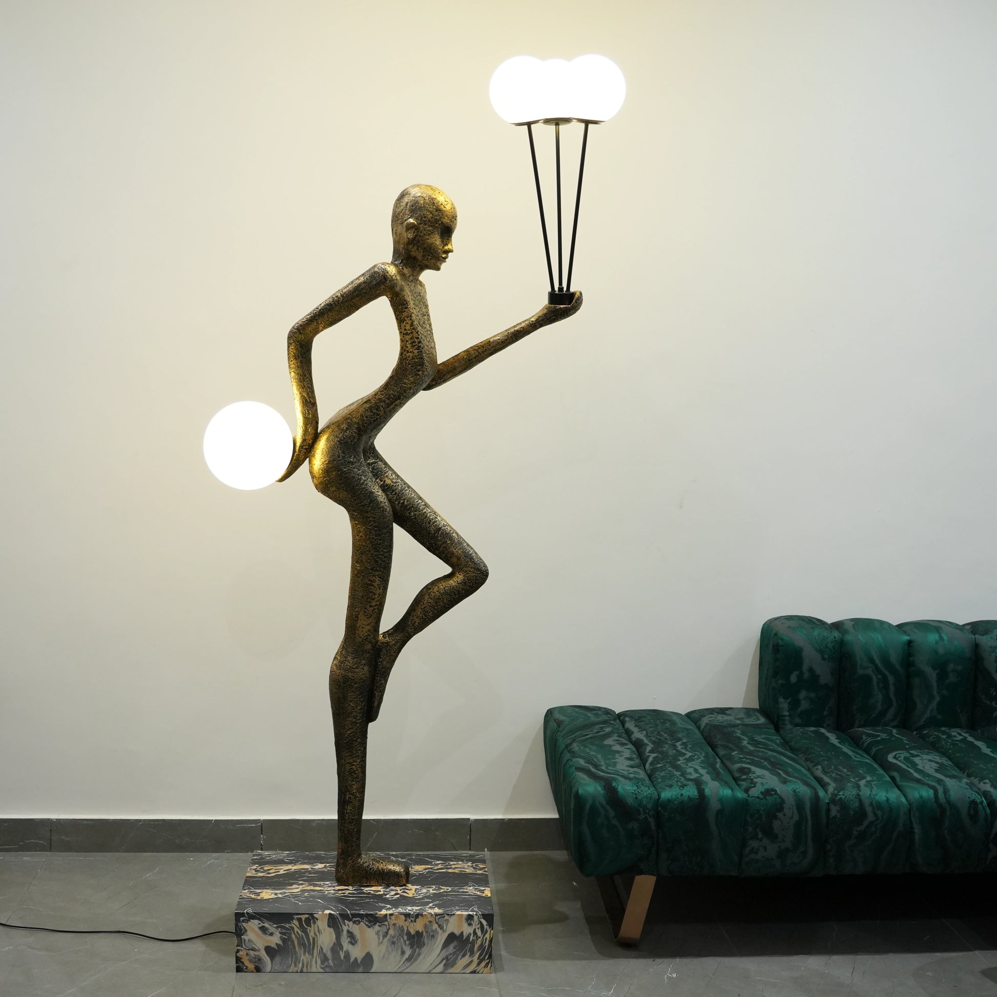 antique gold juggler sculptural floor lamp with orb lights