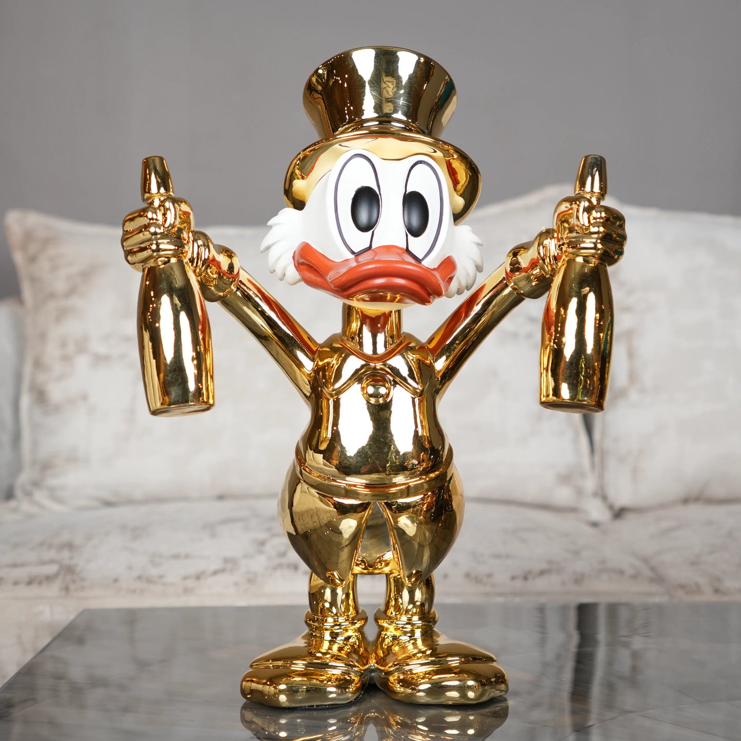 gold duck figurine holding bottles decorative tabletop accent