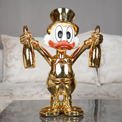 gold duck figurine holding bottles decorative tabletop accent