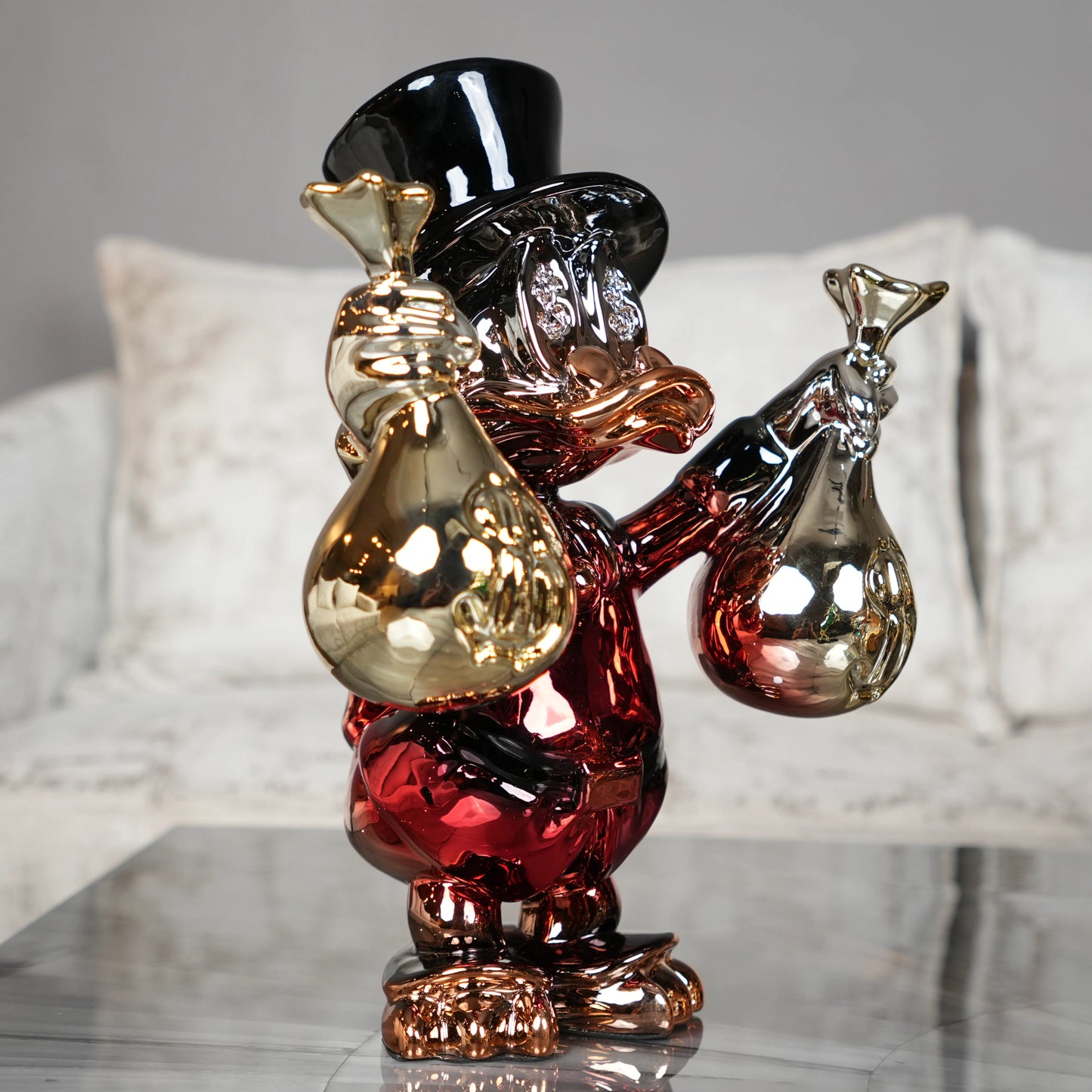 luxury duck decor object with metallic finish and money bags
