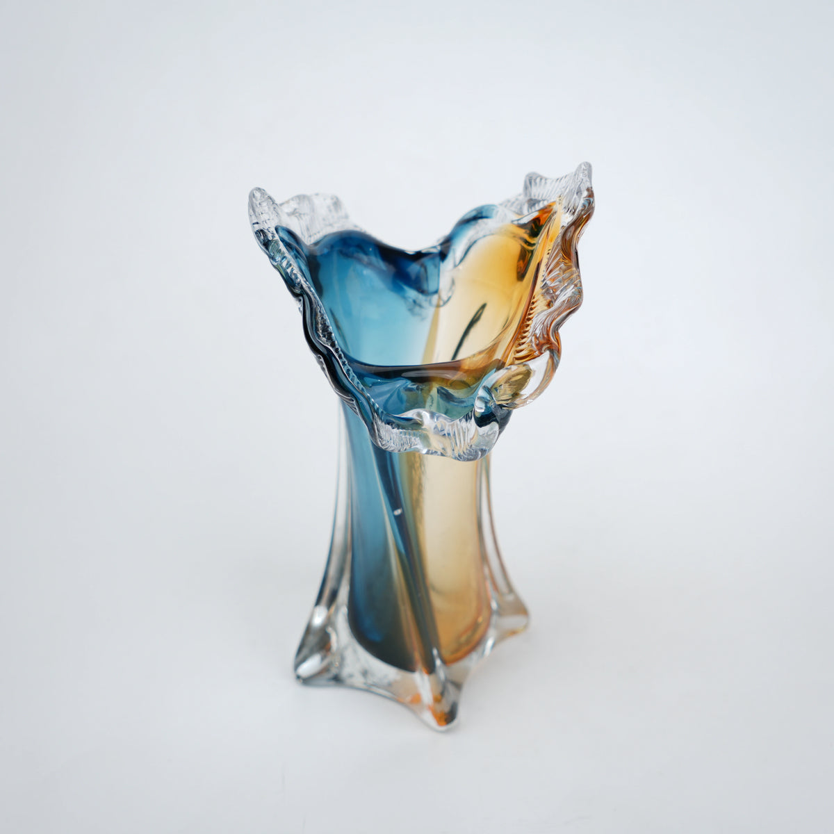 Dual tone blue and amber art glass vase with sculpted rim available in tall and small sizes