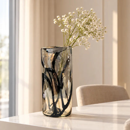 Designer clear glass vase with hand-finished black accents for contemporary interiors.