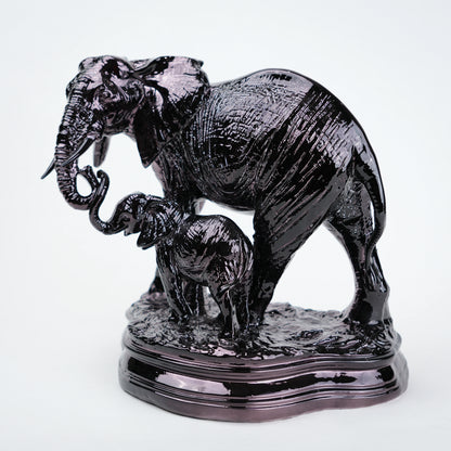 Statue of two elephants on a white background