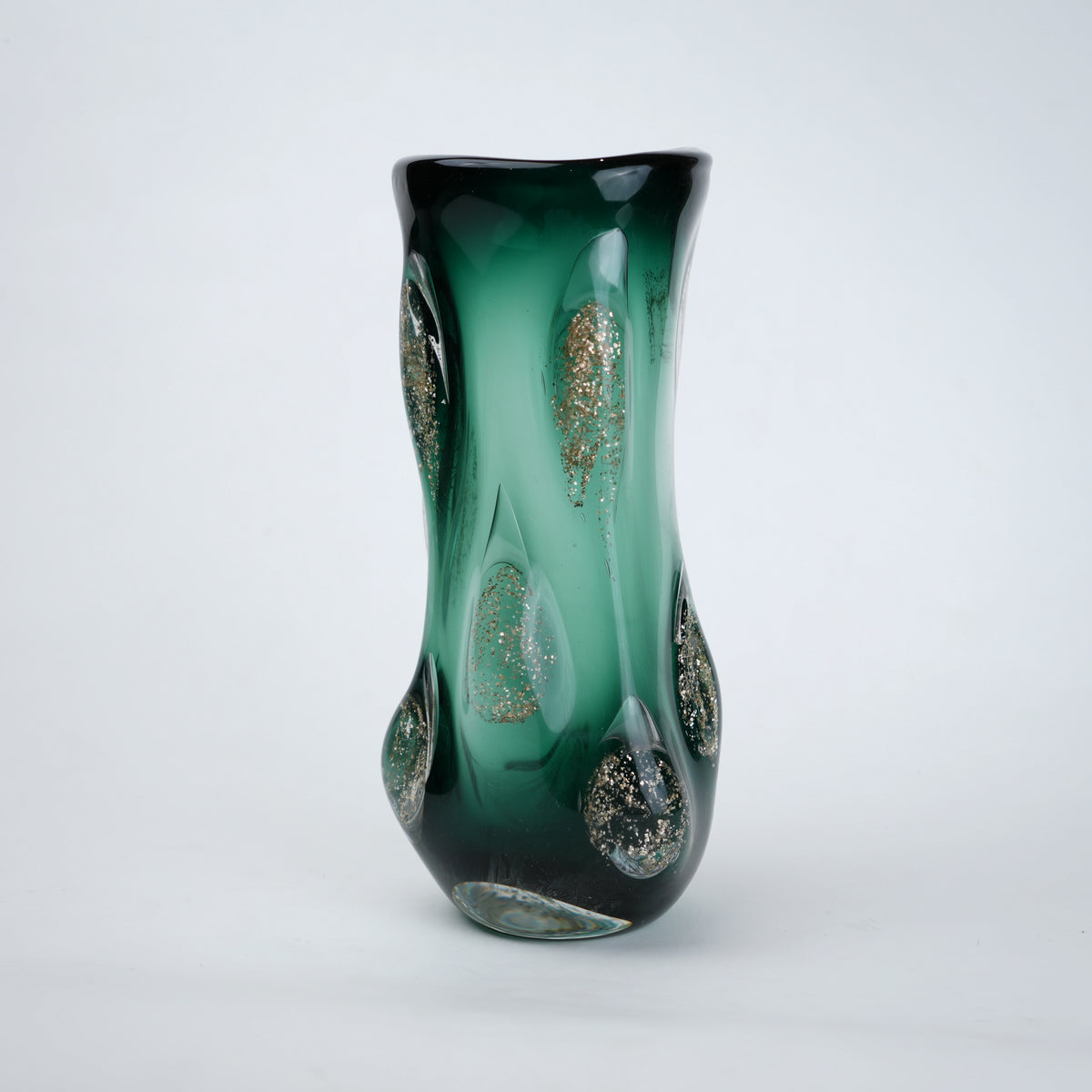 Textured green glass vase with sculpted surface and embedded shimmer accents in deep emerald tone with smooth glossy finish