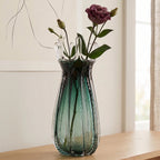 Emerald green glass vase with crown rim design available in small and big sizes for modern decor
