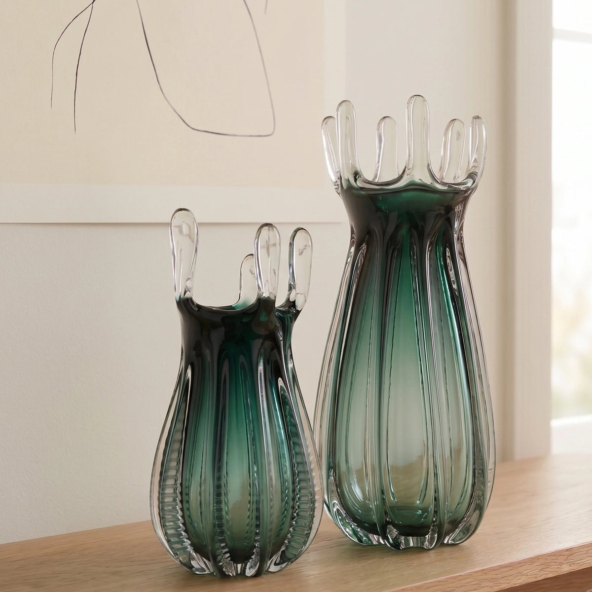 Emerald green glass vase with crown rim design available in small and big sizes for modern decor