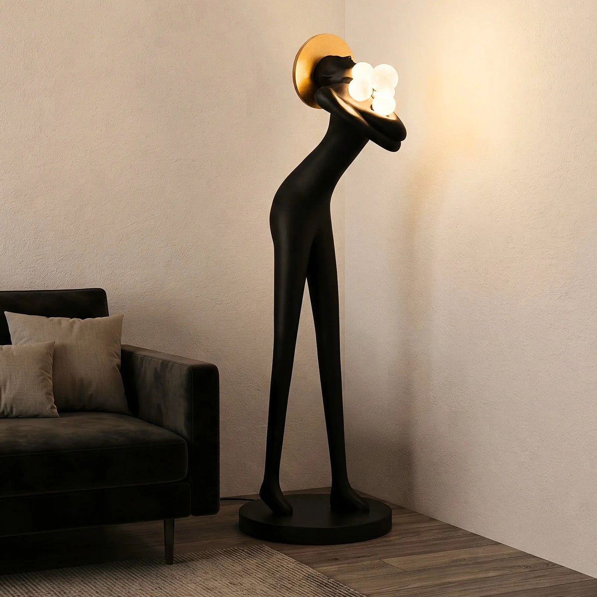 Tall black human-form floor sculpture holding glowing light orbs