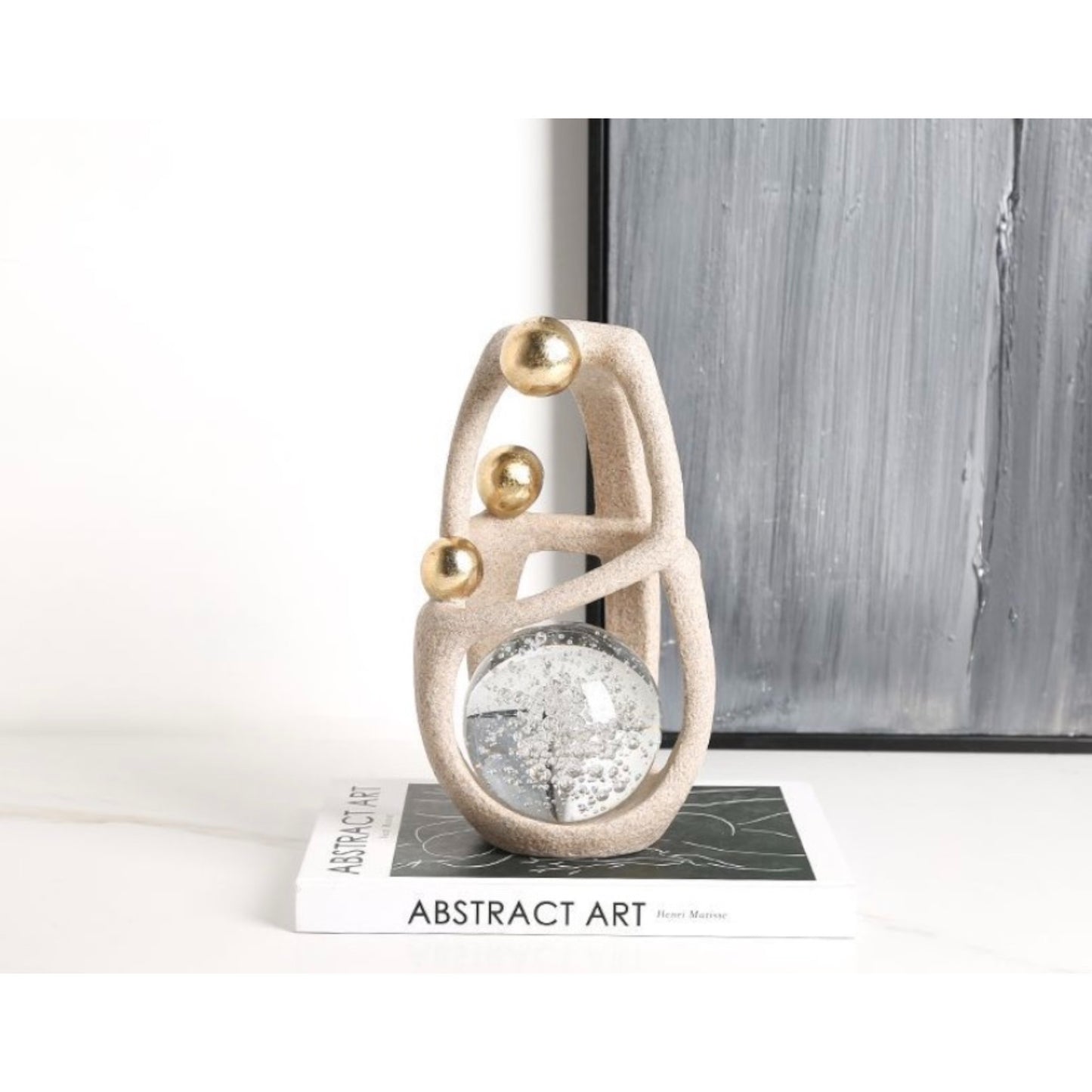 Artful Balance: Matte & Gold Orb Sculpture