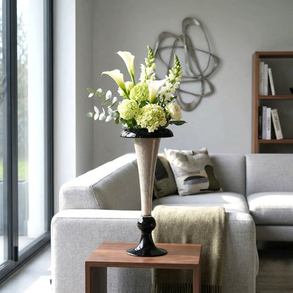 Tall speckle trumpet, calla on walnut table