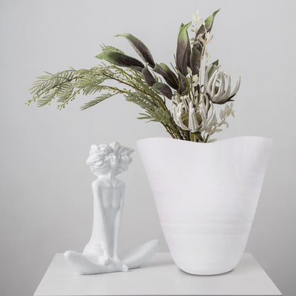 Luxury white resin flower vase featuring a minimalist sculptural silhouette with a soft organic wave rim and matte textured finish, ideal for fresh flowers, dried botanicals and modern designer interiors.