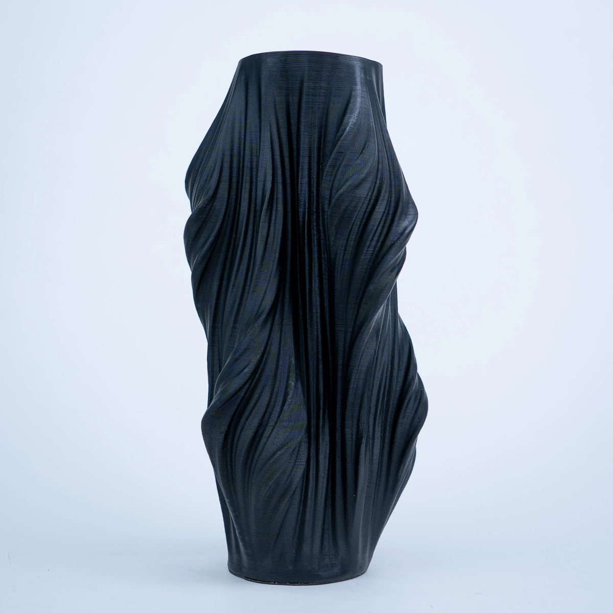 Luxury sculptural resin flower vases featuring flowing artistic textures in matte white and black finishes, ideal for fresh flowers, dried botanicals, console tables and modern designer interiors.`