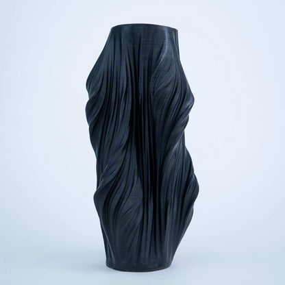 Luxury sculptural resin flower vases featuring flowing artistic textures in matte white and black finishes, ideal for fresh flowers, dried botanicals, console tables and modern designer interiors.`