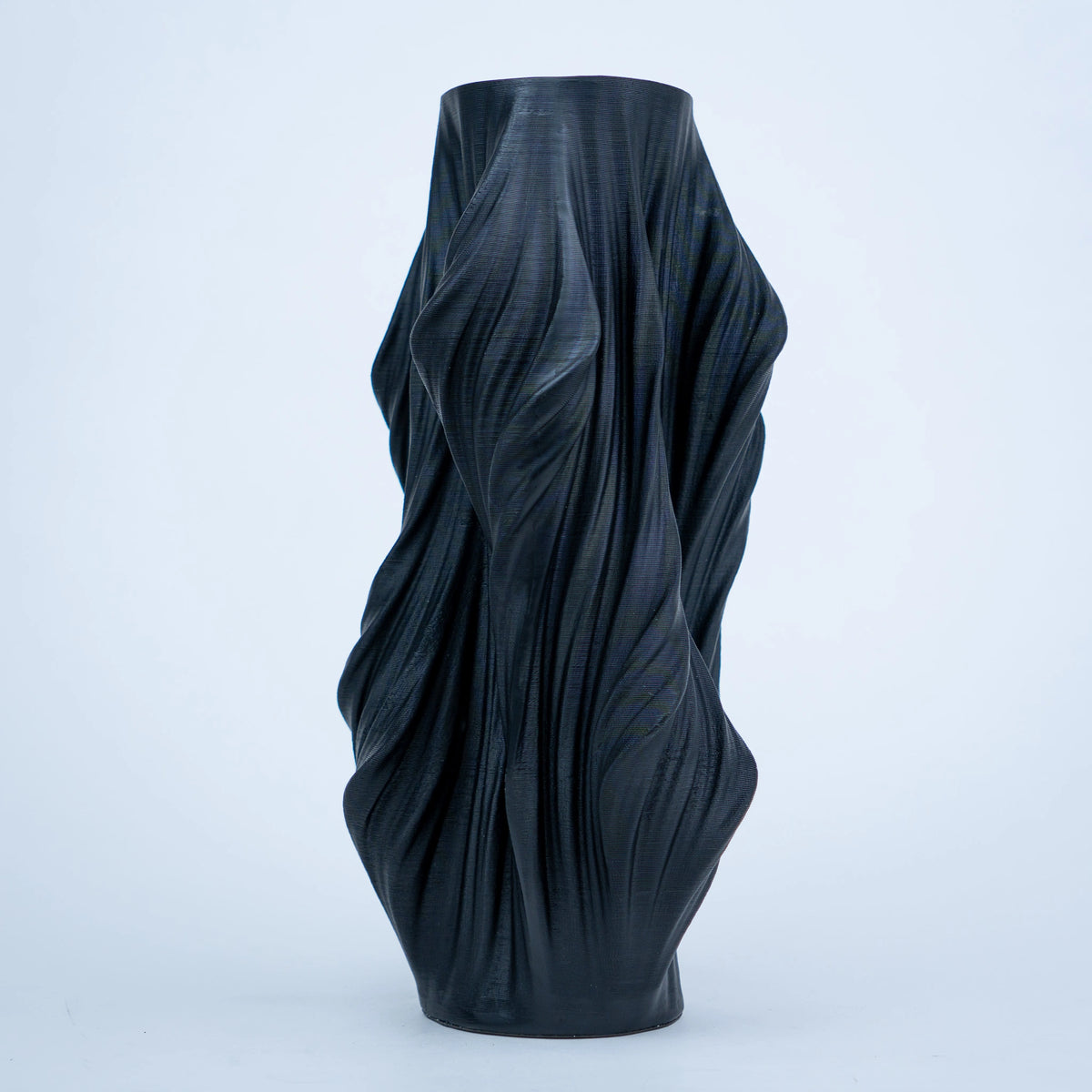 Luxury sculptural resin flower vases featuring flowing artistic textures in matte white and black finishes, ideal for fresh flowers, dried botanicals, console tables and modern designer interiors.`