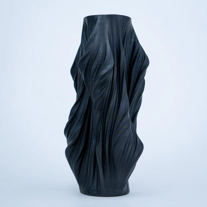 Luxury sculptural resin flower vases featuring flowing artistic textures in matte white and black finishes, ideal for fresh flowers, dried botanicals, console tables and modern designer interiors.`