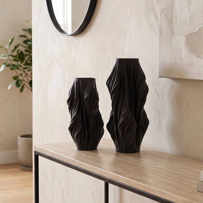 Luxury sculptural resin flower vases featuring flowing artistic textures in matte white and black finishes, ideal for fresh flowers, dried botanicals, console tables and modern designer interiors.`