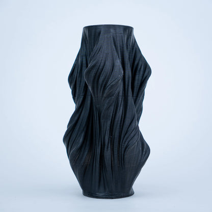 Luxury sculptural resin flower vases featuring flowing artistic textures in matte white and black finishes, ideal for fresh flowers, dried botanicals, console tables and modern designer interiors.`