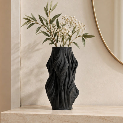 Luxury sculptural resin flower vases featuring flowing artistic textures in matte white and black finishes, ideal for fresh flowers, dried botanicals, console tables and modern designer interiors.`