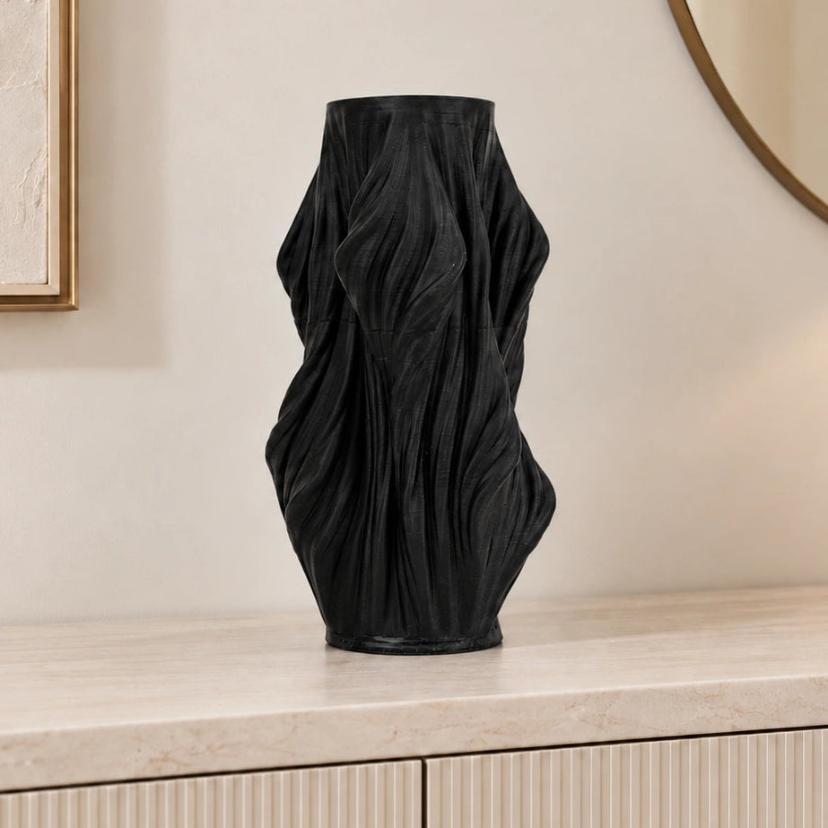 Luxury sculptural resin flower vases featuring flowing artistic textures in matte white and black finishes, ideal for fresh flowers, dried botanicals, console tables and modern designer interiors.`