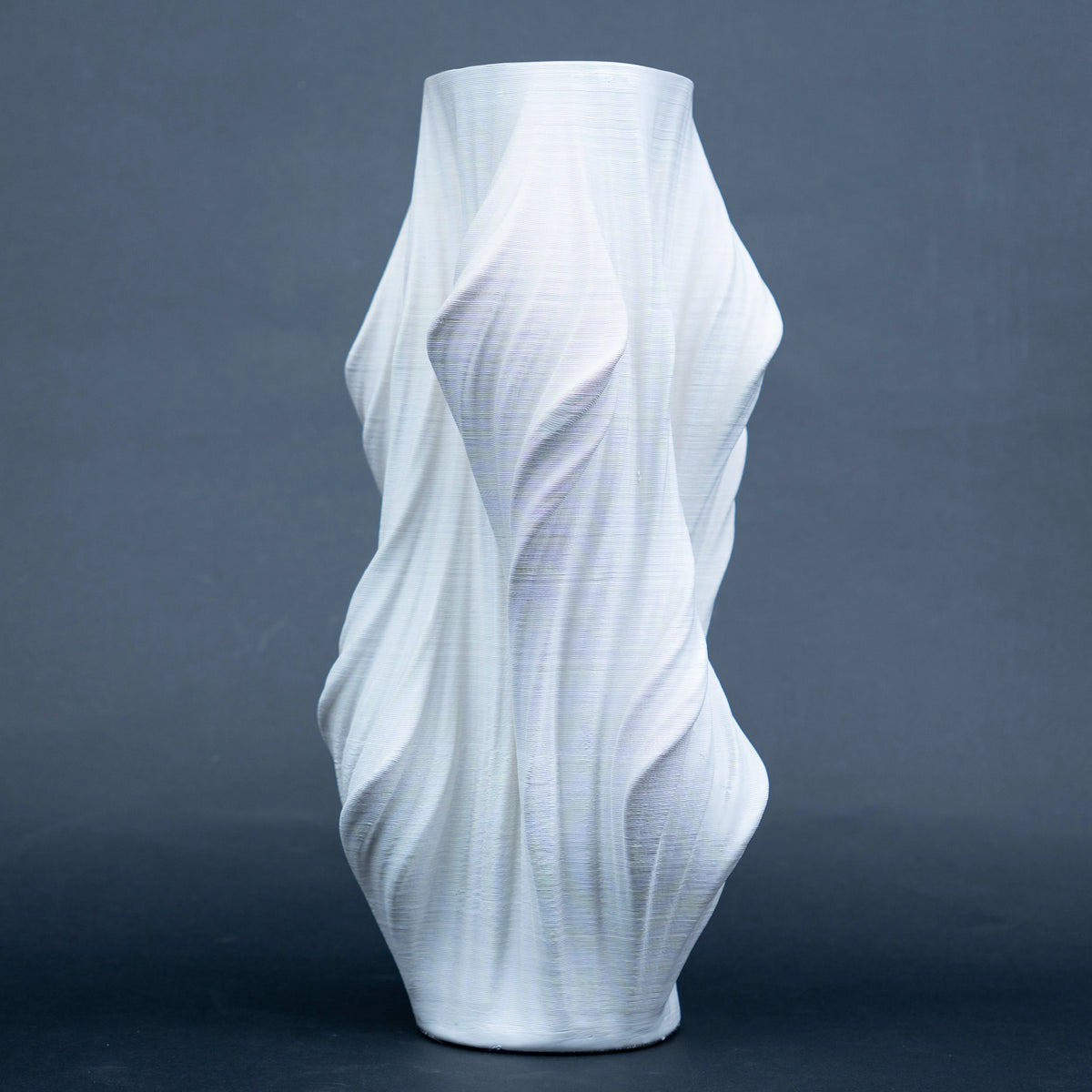 Luxury sculptural resin flower vases featuring flowing artistic textures in matte white and black finishes, ideal for fresh flowers, dried botanicals, console tables and modern designer interiors.`