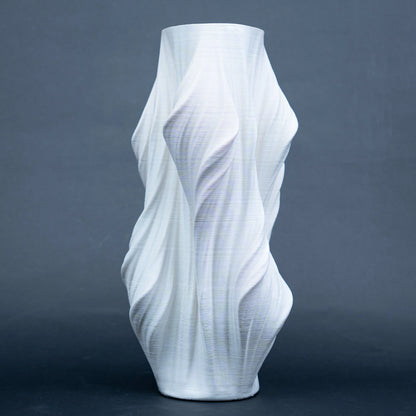 Luxury sculptural resin flower vases featuring flowing artistic textures in matte white and black finishes, ideal for fresh flowers, dried botanicals, console tables and modern designer interiors.`