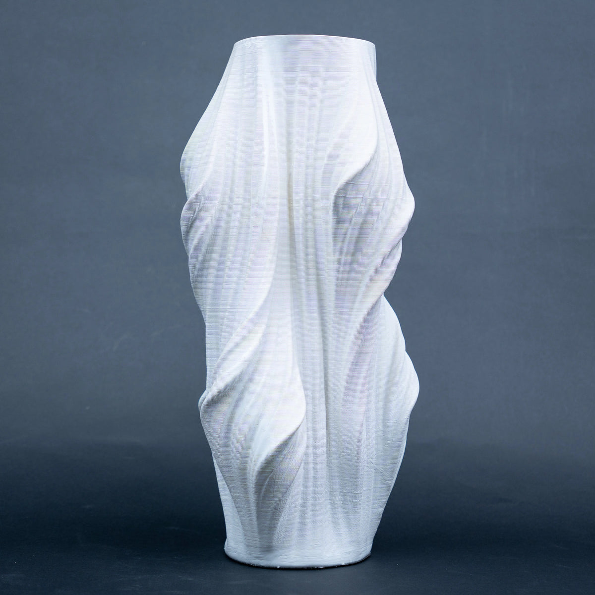 Luxury sculptural resin flower vases featuring flowing artistic textures in matte white and black finishes, ideal for fresh flowers, dried botanicals, console tables and modern designer interiors.`