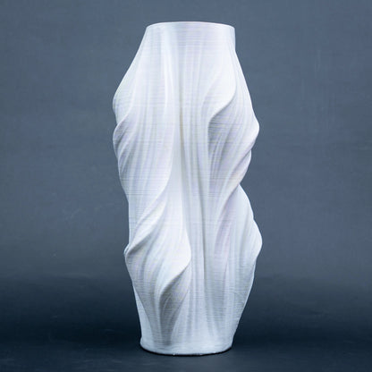 Luxury sculptural resin flower vases featuring flowing artistic textures in matte white and black finishes, ideal for fresh flowers, dried botanicals, console tables and modern designer interiors.`