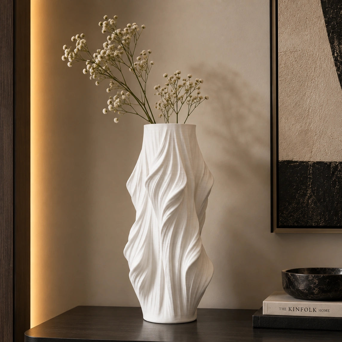 Luxury sculptural resin flower vases featuring flowing artistic textures in matte white and black finishes, ideal for fresh flowers, dried botanicals, console tables and modern designer interiors.`