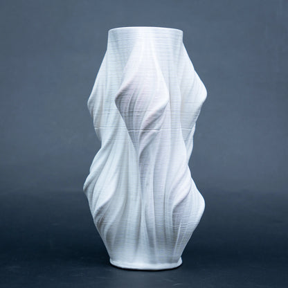 Luxury sculptural resin flower vases featuring flowing artistic textures in matte white and black finishes, ideal for fresh flowers, dried botanicals, console tables and modern designer interiors.`