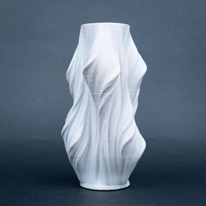 Luxury sculptural resin flower vases featuring flowing artistic textures in matte white and black finishes, ideal for fresh flowers, dried botanicals, console tables and modern designer interiors.`