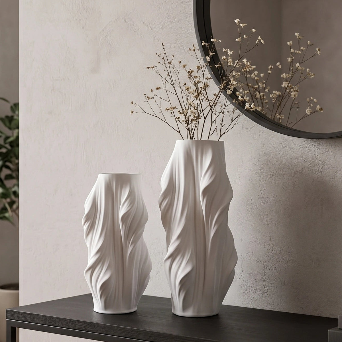 Luxury sculptural resin flower vases featuring flowing artistic textures in matte white and black finishes, ideal for fresh flowers, dried botanicals, console tables and modern designer interiors.`