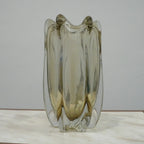 Modern decorative glass vase with smoked transparent finish and organic curved silhouette for luxury home decor