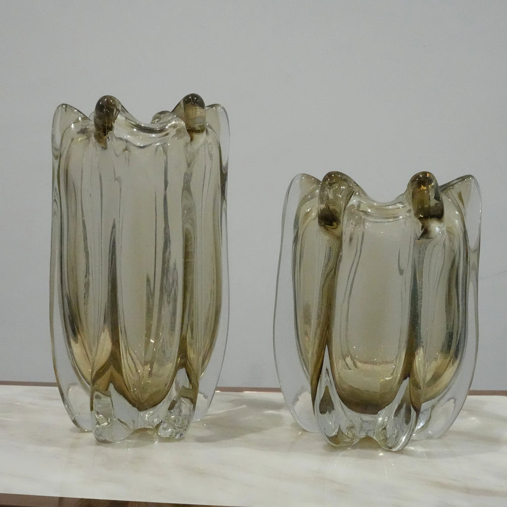 Contemporary art glass vase featuring fluid wave inspired form and handcrafted sculptural detailing for elegant interiors