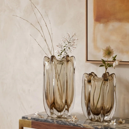 Contemporary art glass vase featuring fluid wave inspired form and handcrafted sculptural detailing for elegant interiors