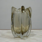 Modern decorative glass vase with smoked transparent finish and organic curved silhouette for luxury home decor