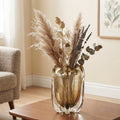 Contemporary art glass vase featuring fluid wave inspired form and handcrafted sculptural detailing for elegant interiors
