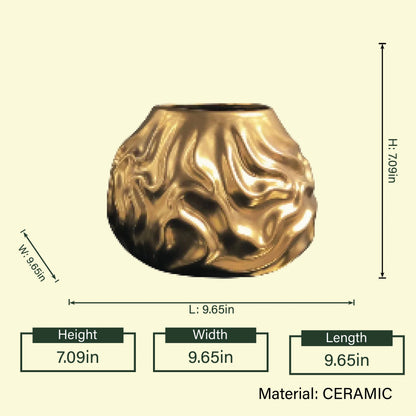 Luxury metallic ceramic decorative vases featuring sculptural fluid textures in gold and silver finishes, ideal for fresh flowers, console tables, dining spaces and modern designer interiors.