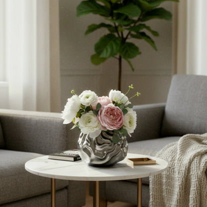 Luxury metallic ceramic decorative vases featuring sculptural fluid textures in gold and silver finishes, ideal for fresh flowers, console tables, dining spaces and modern designer interiors.