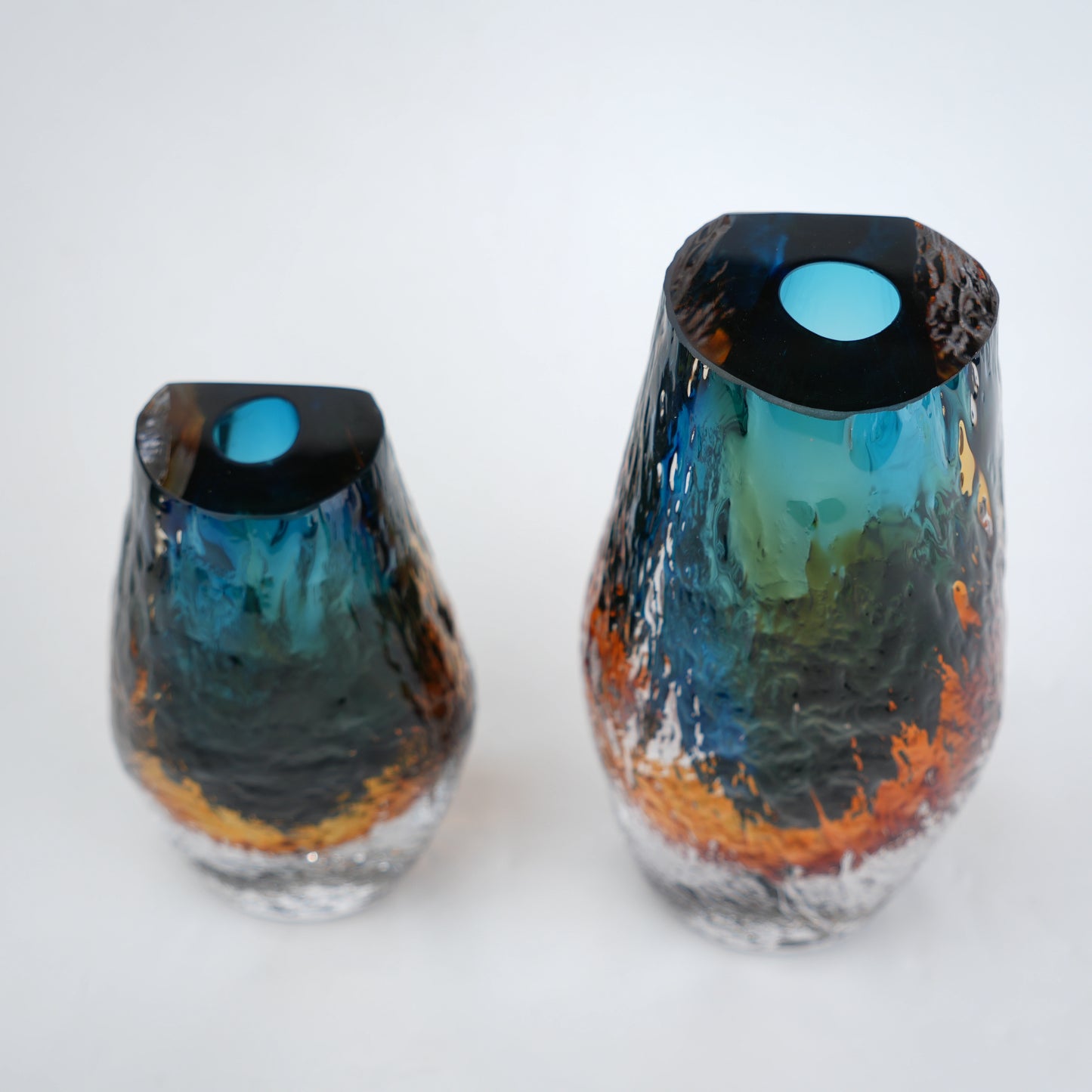 Aqua teal and amber core glass vase with textured clear exterior in two sizes