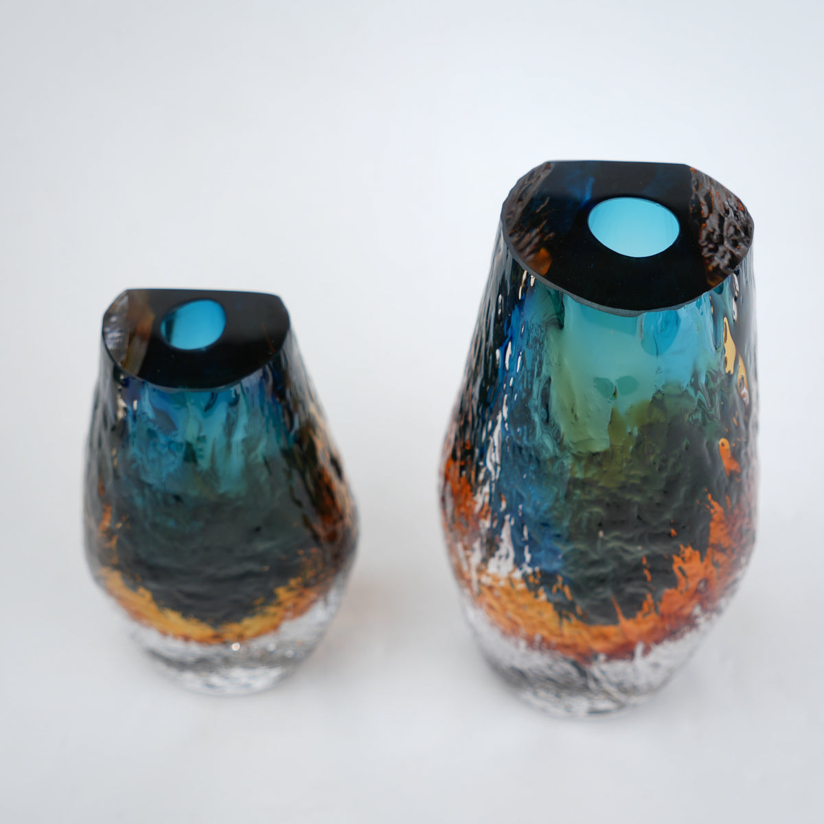 Aqua teal and amber core glass vase with textured clear exterior in two sizes