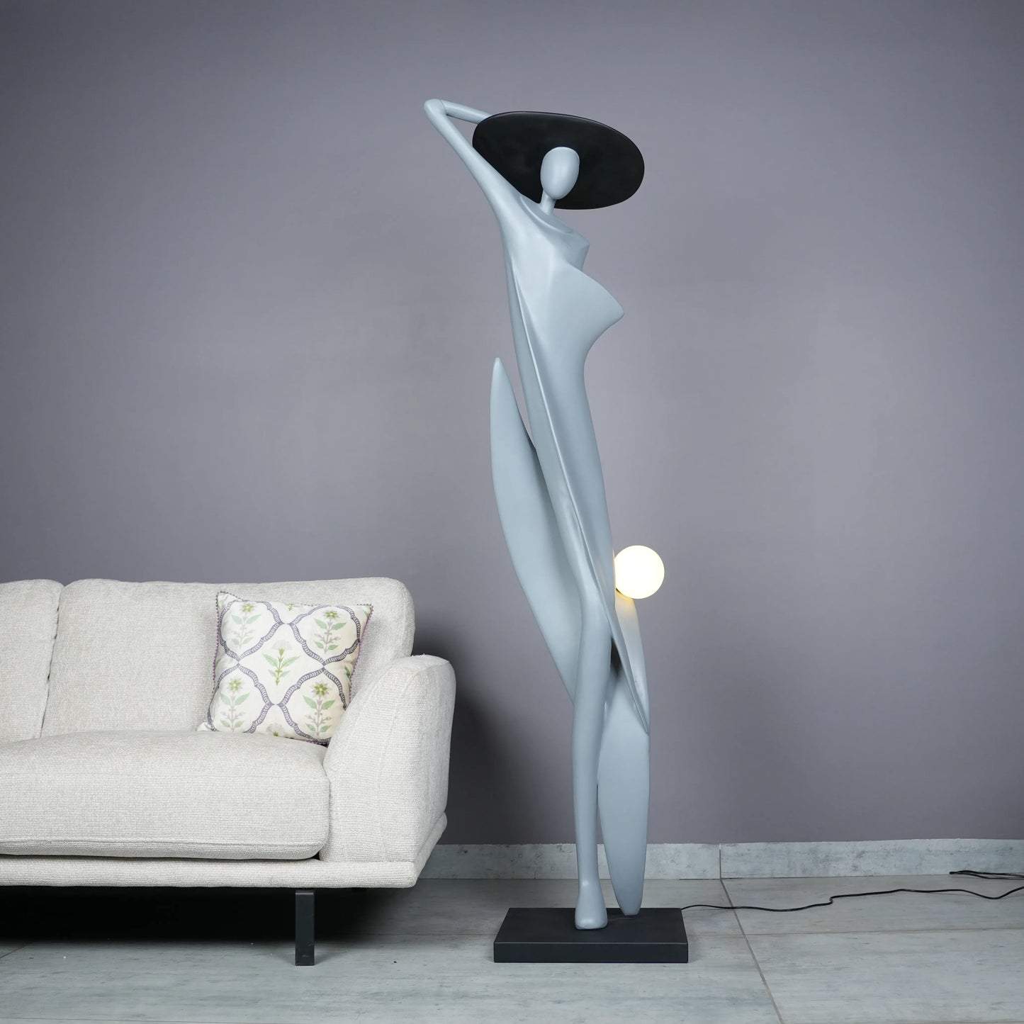 Bluish grey lady sculpture floor lamp with black hat and glowing orb – modern artistic lighting.