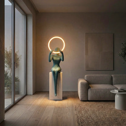 Luxury contemporary figure floor lamp featuring glowing LED halo light and abstract artistic silhouette design for premium home styling