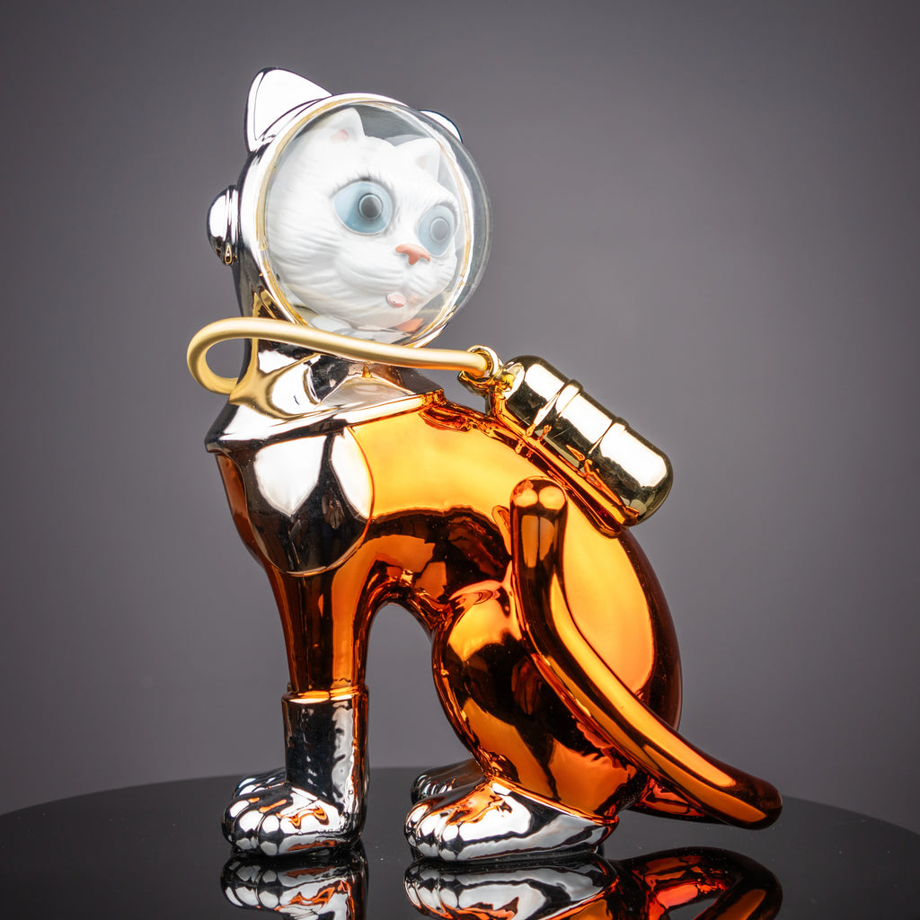 Luxury astronaut cat figurine with metallic silver and amber finish featuring futuristic space-inspired decorative styling for modern interiors