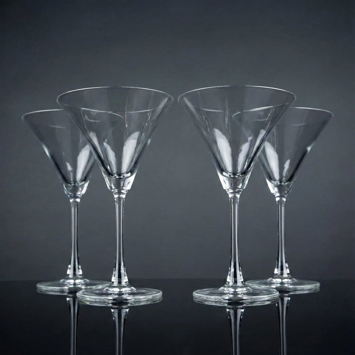 Modern martini glass collection with crystal-clear stemware and olive garnishes for elegant home entertaining arrangements