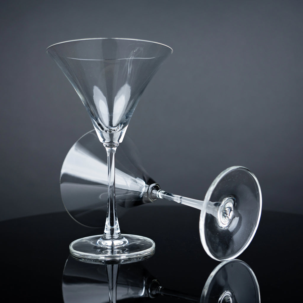 Modern martini glass collection with crystal-clear stemware and olive garnishes for elegant home entertaining arrangements