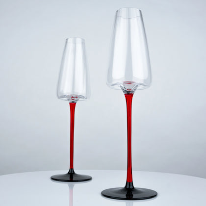 set of 4 clear champagne flutes with slim red stem and black base