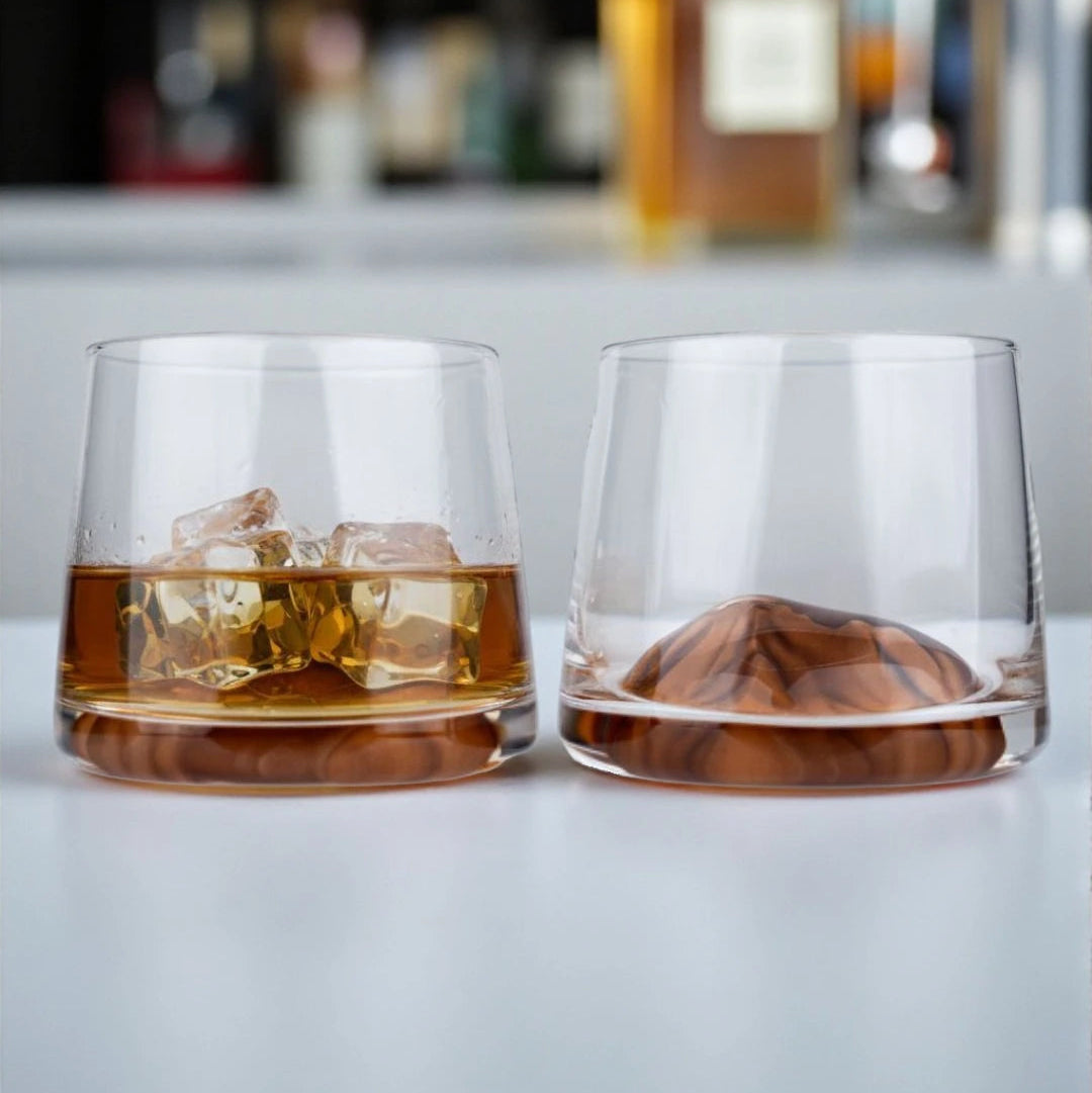 Designer whiskey tumblers with artistic amber base accents for luxury drinkware collections and modern entertaining setups