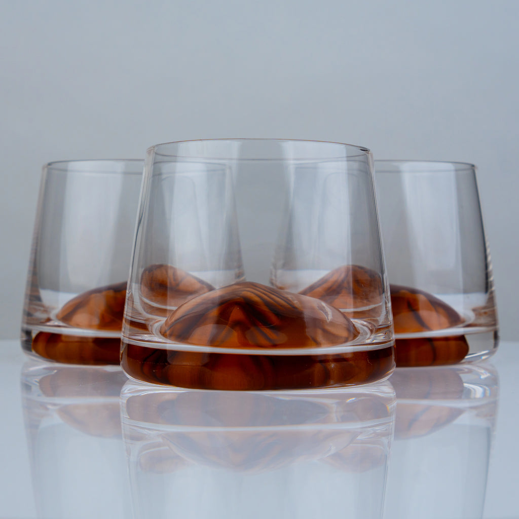 Premium whiskey drinking glasses with elegant amber detailing for sophisticated cocktail serving and contemporary bar styling