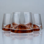 Premium whiskey drinking glasses with elegant amber detailing for sophisticated cocktail serving and contemporary bar styling