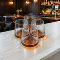 Designer whiskey tumblers with artistic amber base accents for luxury drinkware collections and modern entertaining setups